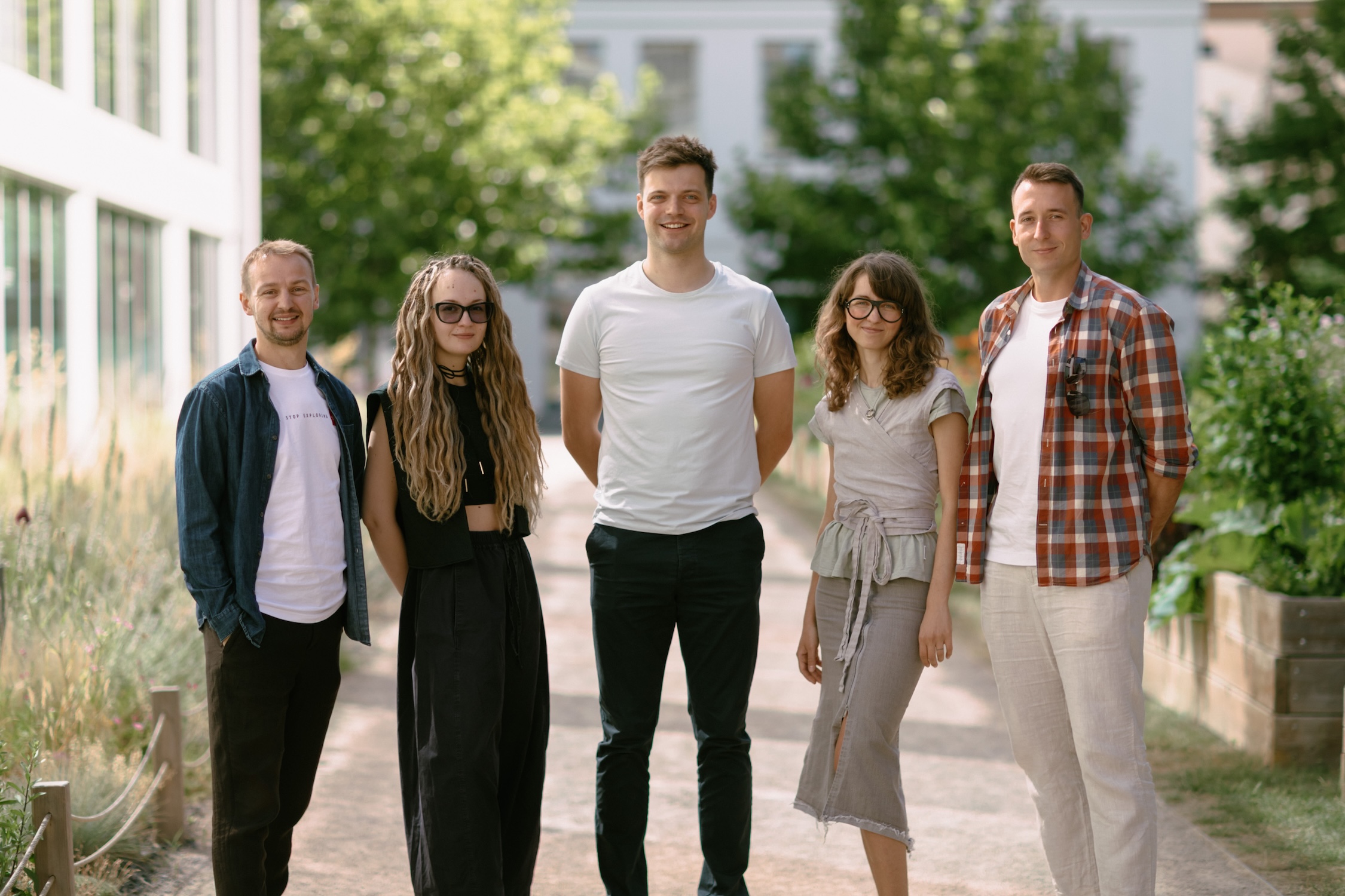The Aim team standing together outdoors